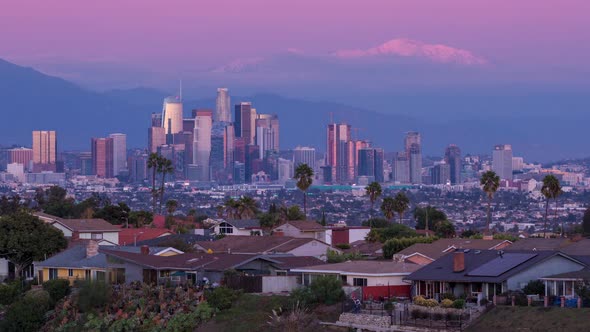 Downtown Los Angeles Skyline and Snowy Mount Baldy Mountain Sunset