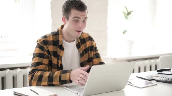 Internet Video Chat Via Laptop By Casual Young Man