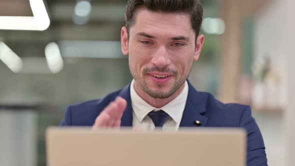 Close Up of Businessman Doing Video Call on Laptop