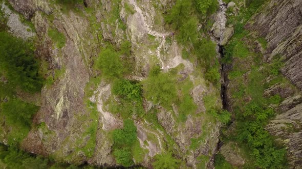 drone view of a mountain trail, people are walking in the nature. swiss alps, aerial.