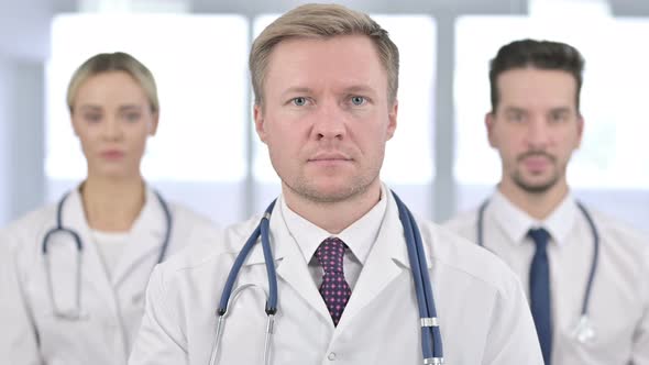 Portrait of Serious Team of Doctors Looking at the Camera