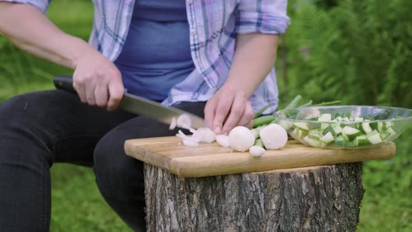 Close Up of Female Hands Making Vegetable Salad in Garden Outdoor