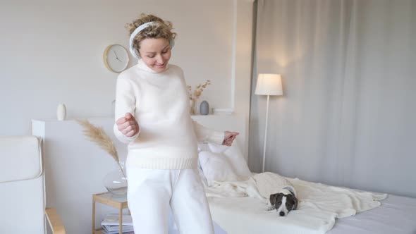 Cheerful Pregnant Woman In Headphones Dancing At Home