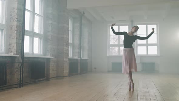 Young Ballerina Dancing In Empty Choreography Class