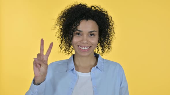 Portrait of Successful Casual African Woman Showing Victory Sign