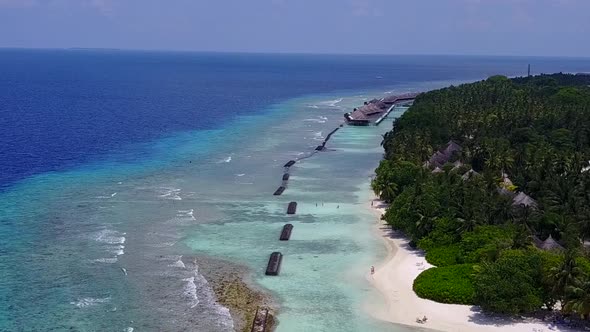 Drone tourism of shore beach break by lagoon and sand background