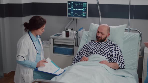 Sick Man Resting in Bed Wearing Oxygen Tube Explaining Disease Symptom