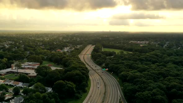 An aerial time lapse over the suburbs of Valley Stream. It was taken during a cloudy sunrise.. The d