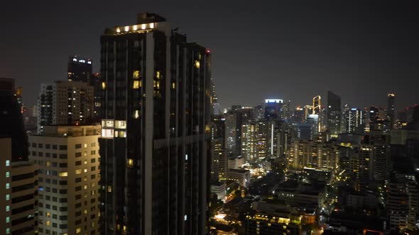 Cinematic View of Buildings of the City Looks Bright at Night