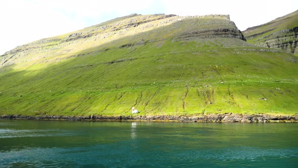 Ferry Arriving to the Port in Sydradalur