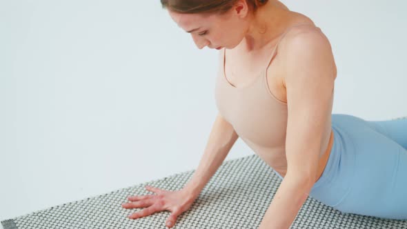 Close-up of young woman with exercise mat for yoga training. Healthy lifestyle concept