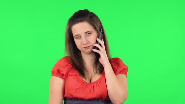 Portrait of Cute Girl Talking for Mobile Phone. Green Screen