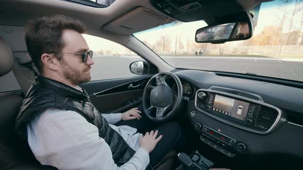 One Person Sits in a Selfdriving Car During Parking