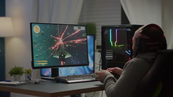 Focused Pro Cyber Keeping Hands on Head After Losing Space Shooter Video Game