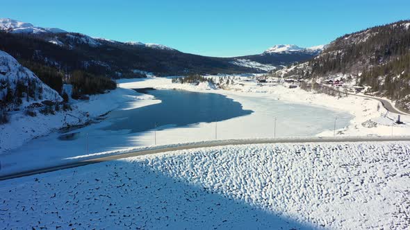 Aerial rotating in front of Tunhovd dam - Statkraft operated water reservoir for hydroelectric power