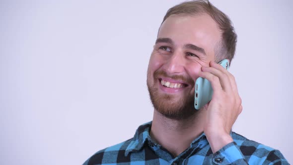 Face of Happy Bearded Hipster Man Talking on the Phone
