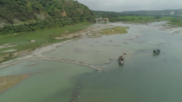 Cleaning and Deepening By a Dredger on the River. Philippines, Luzon