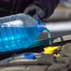 Filling Up a Windshield Washer Tank of a Car By Antifreeze Close Up - VideoHive Item for Sale