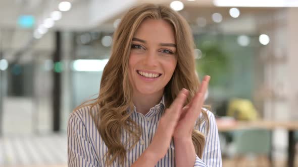 Portrait of Excited Businesswoman Clapping Applauding