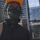 Portrait Young Black Man Wearing Wearing a Medical Coronavirus Protective Mask and Standing Outside - VideoHive Item for Sale