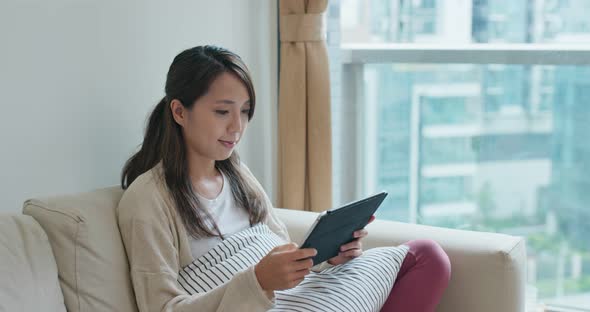 Woman use of tablet computer at home