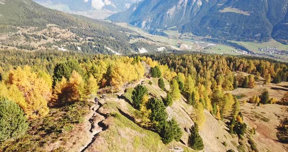 Aerial drone view of a mountain biker on a singletrack trail.