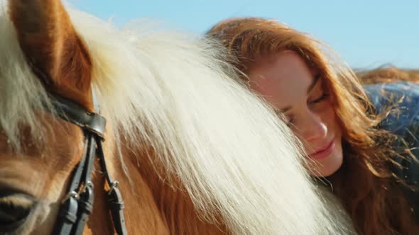 Young woman leaning on horse with eyes closed