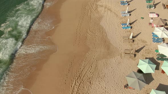 Parasols At The Seashore With Crashing Waves - Yelapa Beach In Jalisco, Mexico. Aerial Drone Shot