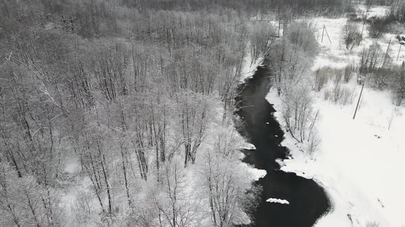 Beautiful Winter Landscape with a Stormy River Aerial View