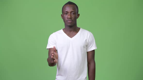 Young African Man Giving Handshake