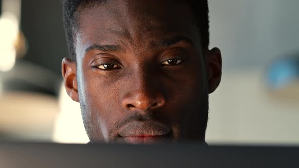 Young freelancer surfing the internet using a laptop