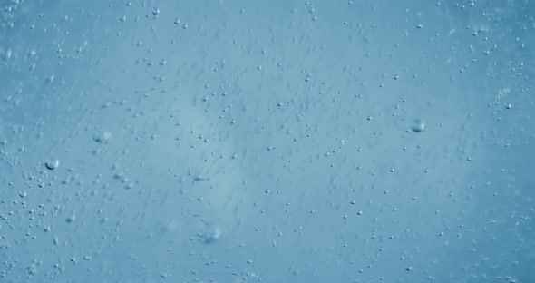 Oxygen Bubbles in Water on a Blue Abstract Background