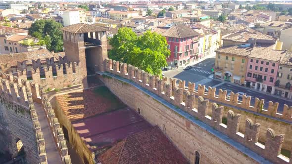 Verona,Italy:Aerial view of Castelvecchio Castle.Drone flies near the wall tower.Aerial video in 4K.