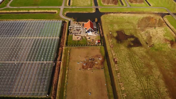 Aerial Rising Over Agricultural Greenhouses In Fields Of Barendrecht.