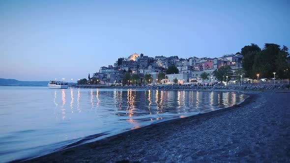 Landscape view of Bracciano town and Lake Bracciano, Italy, at night