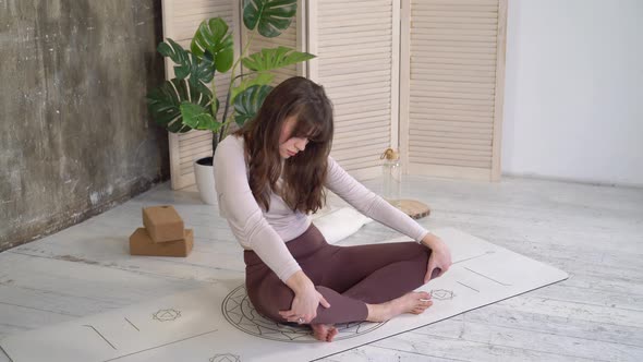 Woman doing yoga exercises