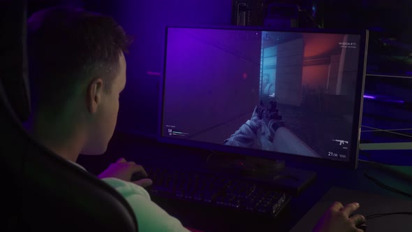 Gamer is using military rifle weapons in the modern computer shooter game