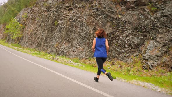 Woman running in mountains