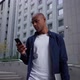 African American Man Sms Texting Using App on Smart Phone in City. - VideoHive Item for Sale