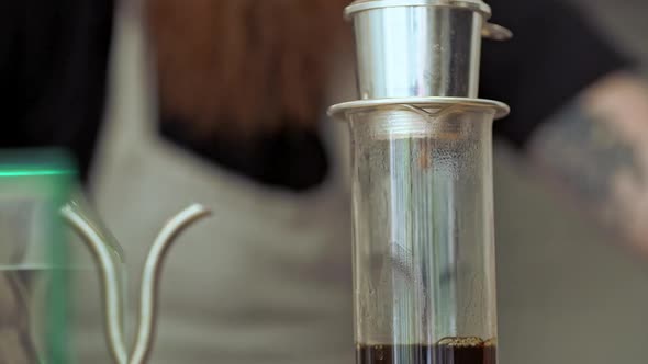 Barista Making Coffee in Coffeeshop