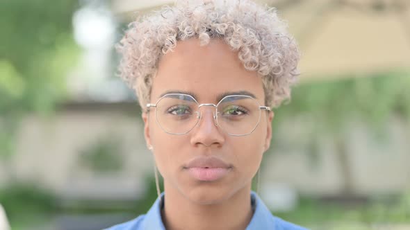 Face Close Up of Serious Young African Woman Looking at Camera