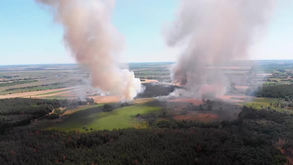 Aerial View of Fire in Wheat Field. Flying Over Smoke Above Agricultural Fields