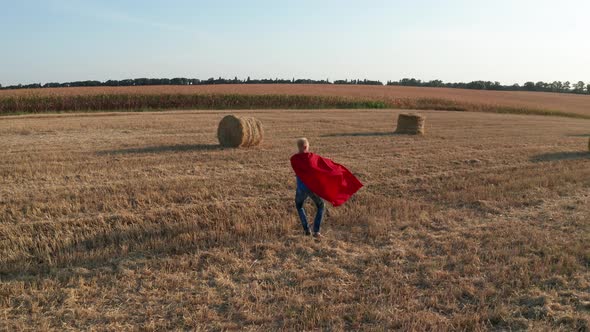 Aerial Shot of Dad Circling Son Over Wheat Field