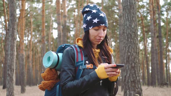 Young Woman Hiking Nature in Pine Forest