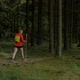 active female hiker woman walking outdoors on a trail in the woods - VideoHive Item for Sale