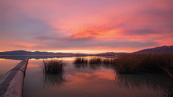 Sunset time lapse of pipe going into Utah Lake