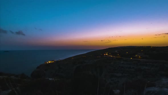 Mixture of colours during sunset over ocean from Blue Grotto, Malta, time-lapse