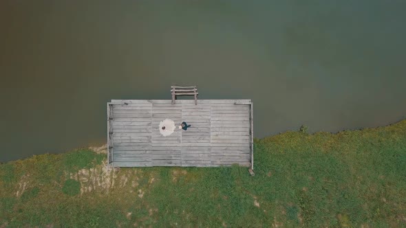 Groom with Bride Near Lake in the Park. Wedding Couple. Aerial Shot