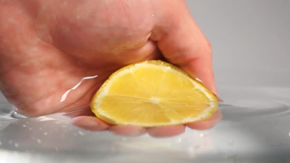 Grabbing Lemon From Water