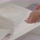 Closeup Female Hands Take Clean Fresh Folded White Towel From Shelf - VideoHive Item for Sale